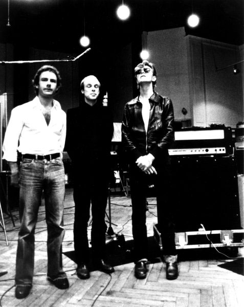 BERLIN - 1977:  Robert Fripp, Brian Eno and David Bowie pose for a portrait in the studio where they are recorded "Heroes" in 1977 in Berlin, Germany. Photo by Michael Ochs Archives/Getty Images